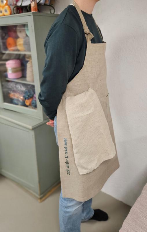 Linne förkläde, "Små smulor är också bröd"