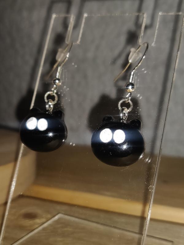 Resin earrings with reflective eyes 